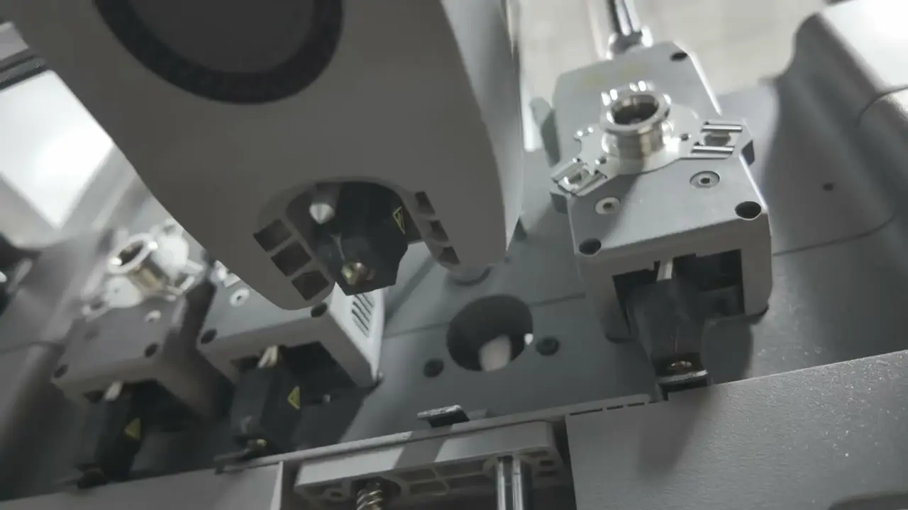 Close-up of the Creator 5 tool rack, showing a toolhead and metal docking hardware