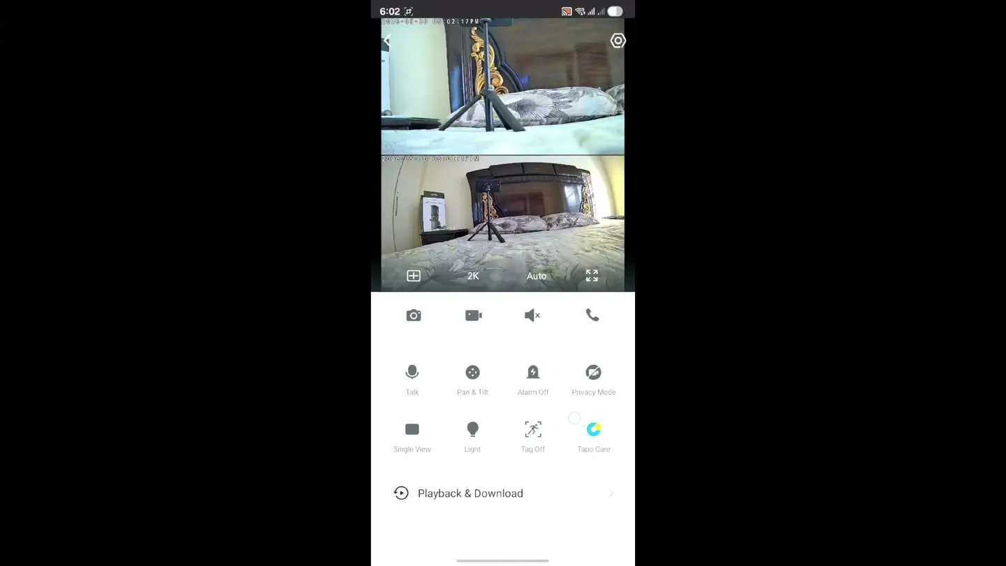The Tapo app showing both camera feeds at once — the wide lens and the telephoto lens — with the live-view control panel