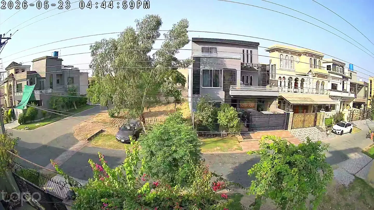 A daylight still from the C645D's wide 2K lens showing a street scene where distant detail is not sharp