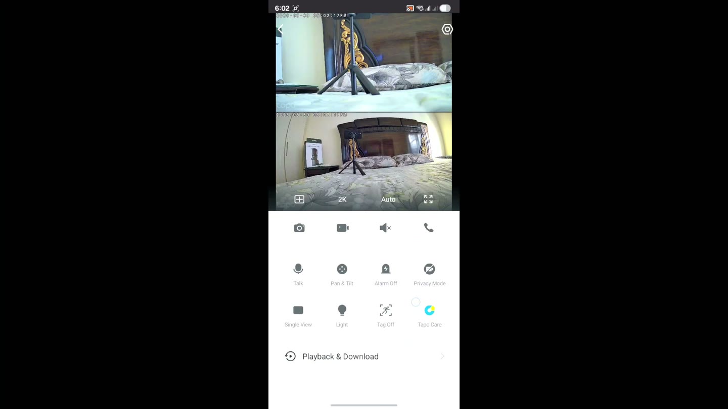 The Tapo app showing both camera feeds at once — the wide lens and the telephoto lens — with the live-view control panel
